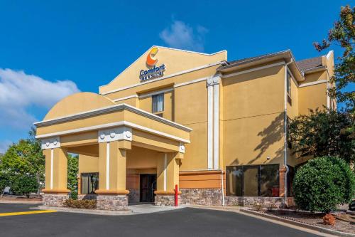 a hotel building with a sign on the front of it at Comfort Inn & Suites Atlanta-Smyrna in Atlanta