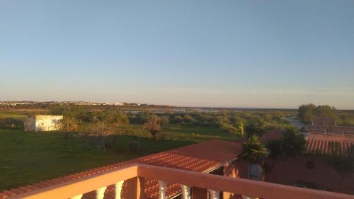 a view from the balcony of a house at Villa Paradis Pêra - Quartos para férias in Pêra