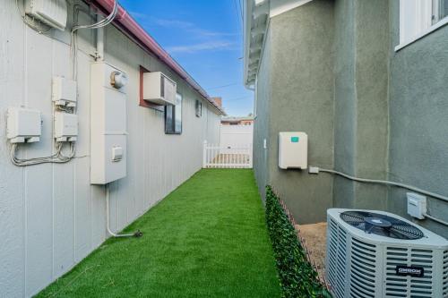 an alley between a building with an air conditioner at Luxury 4-bed home in Riverside Heights! in Reno