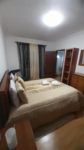 Ένα ή περισσότερα κρεβάτια σε δωμάτιο στο Casa da Magnólia