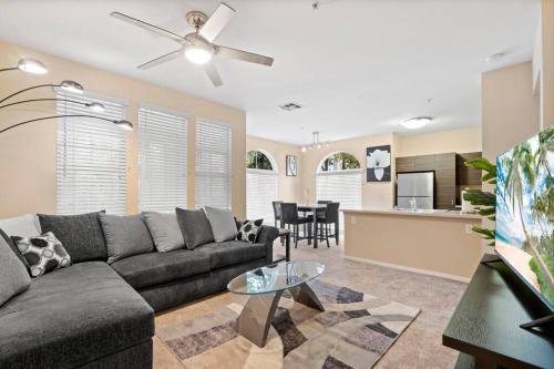 a living room with a couch and a table at Lovely & coxy 2BR/2BA! 5MIN to Disney! in Anaheim