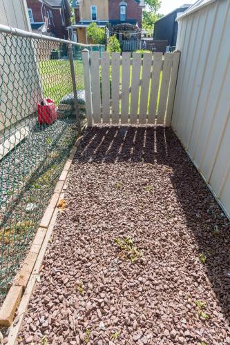 a fence in a yard next to a building at Luxurious Retreat, Parking, Restaurants, Near New Hope, 1mile Delaware River in Lambertville