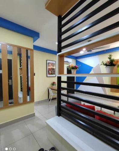 a room with a bed and a mirror at Shaftsbury Residence Cyberjaya with free parking & Netflix in Cyberjaya