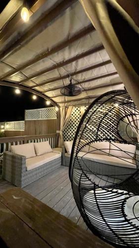 a room with two beds and a swing at Luxurious Retreat, Parking, Restaurants, Near New Hope, 1mile Delaware River in Lambertville