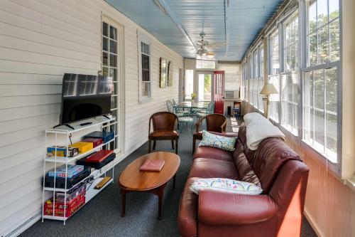 a living room with a couch and a table at Historic Warren Vacation Rental Walk to Beaches! in Warren