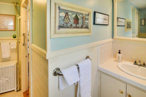 a bathroom with a sink and a mirror at Historic Warren Vacation Rental Walk to Beaches! in Warren
