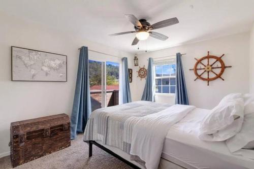a bedroom with a bed and a window at Pacifica Storybook Beach House in Pacifica