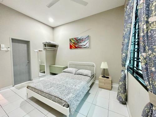 Postelja oz. postelje v sobi nastanitve RooMa DeQue Melaka With Private Pool