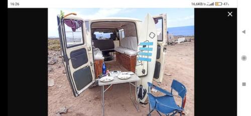 a camper van with a table and chairs in the desert at canary van for drive, near to TFS Mercedes MB130 in Adeje