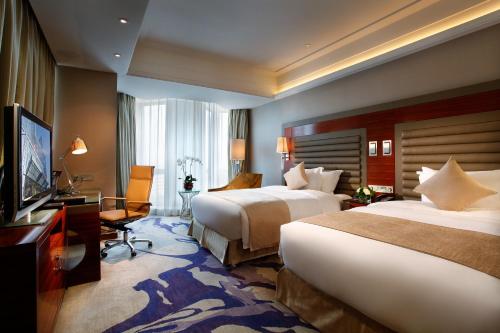 Cama o camas de una habitación en Crowne Plaza Shenyang Parkview, an IHG Hotel