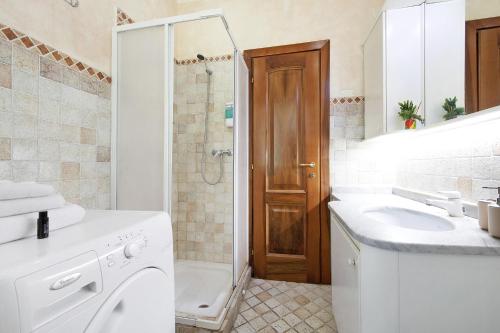 a bathroom with a toilet and a sink and a shower at Il ponte dei sogni in Brescia