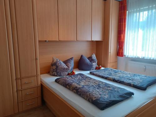 Ένα ή περισσότερα κρεβάτια σε δωμάτιο στο Bergblick-Seitz