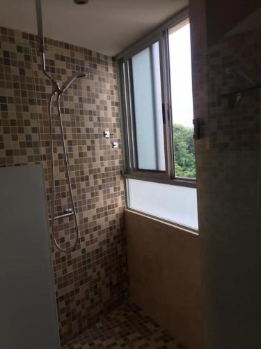 a bathroom with a shower and a window at Ponto Horizonte Manzanillo. Best place in Manzanillo!!! Luxury beach front condo, gorgeous views!! Best place you can stay!with up to 8 people. in Manzanillo