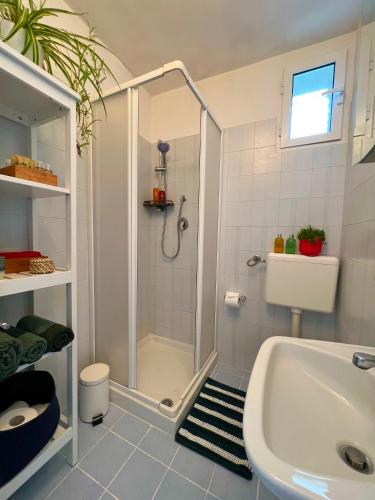 a bathroom with a shower and a tub and a sink at Q40 Ostuni in Ostuni