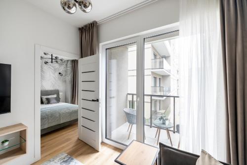 Postel nebo postele na pokoji v ubytování Žalia kopa Metropolis Vilnius