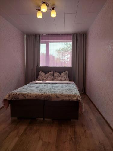 Postel nebo postele na pokoji v ubytování Võhandujõe guest apartment