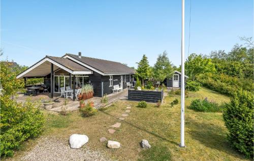 a house with a flag in front of it at Amazing Home In Tarm With Kitchen in Tarm