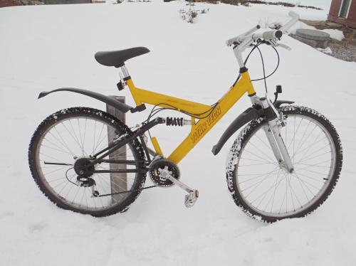 a bike is parked in the snow at House near the University in Ås - Ski in Ås