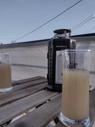 a drink in a glass on a table next to a blender at MickeyHouse in Agria
