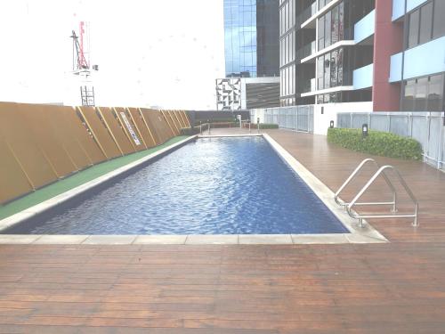 a swimming pool in the middle of a building at AKOM AT Docklands in Melbourne