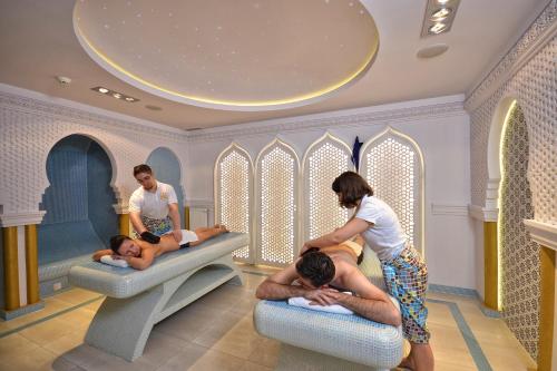 a group of people in a room with babies in beds at Hotel Białowieski Conference, Wellness & SPA in Białowieża