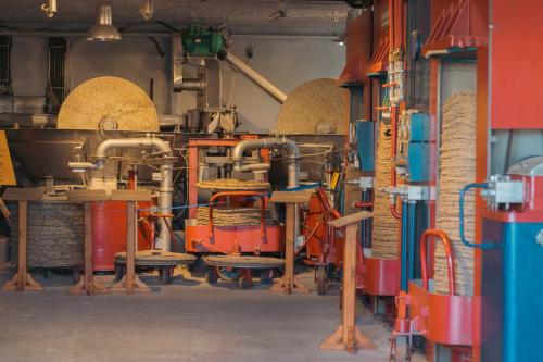 a factory with lots of pipes and baskets at Amaya Pine Studio in Panayia