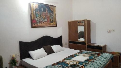 Ένα ή περισσότερα κρεβάτια σε δωμάτιο στο Peaceful Home Stay