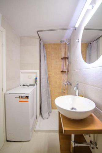 a bathroom with a sink and a water heater at Casa Iolanda I in Corfu