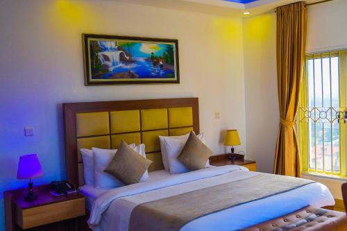 a bedroom with a large bed in a room at Nisa Wellness Retreat in Abuja