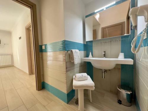 a bathroom with a sink and a mirror at Appartamenti Santa Rita in Maiori