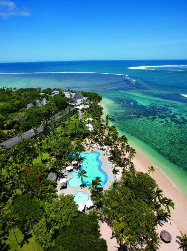 an aerial view of the resort and the beach at Shangri-La Yanuca Island, Fiji in Voua