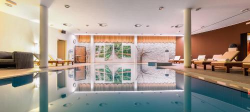 a house with a swimming pool with a living room at Villa Arausa in Vodice