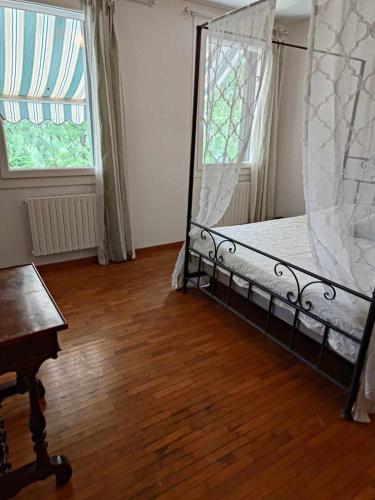 a bedroom with a bed and a window and a wooden floor at Traghetto vecchio house in Cavallino-Treporti