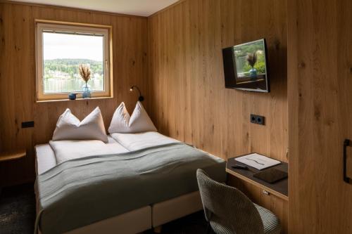 Postel nebo postele na pokoji v ubytování Ferienwohnung Wörthersee - by 24 Holiday
