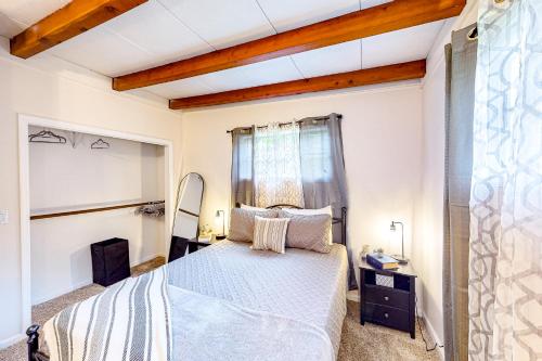 a bedroom with a large bed and a window at Jacques Tranquility in Fort Oglethorpe
