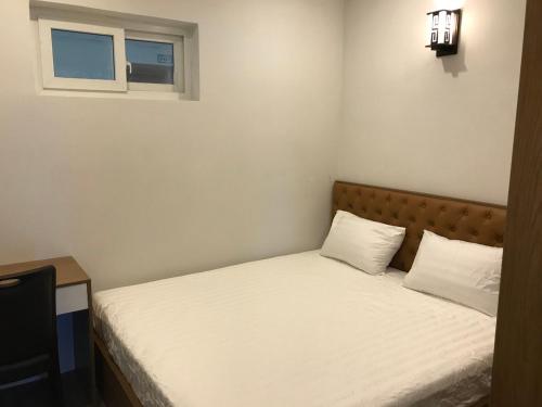 Giường trong phòng chung tại MUONGTHANH APARMENT OCEAN - 2 Bedrooms