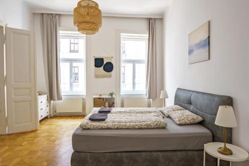 Postel nebo postele na pokoji v ubytování Vienna City Apartments Unteres Belvedere