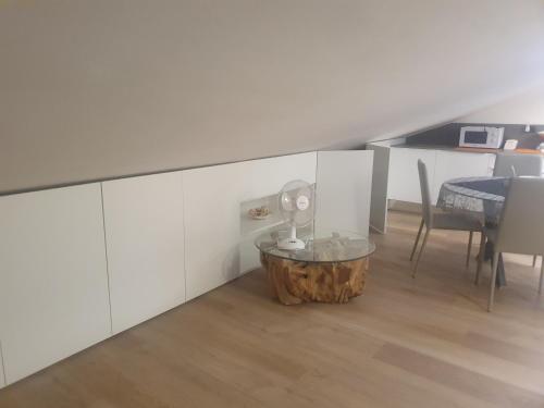 a living room with a coffee table and a dining room at Sestri DeLuxe Penthouse All Included in Sestri Levante