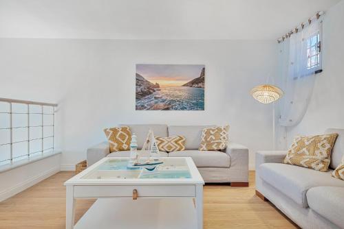 a living room with a couch and a table at L'incanto di Venere in Portovenere