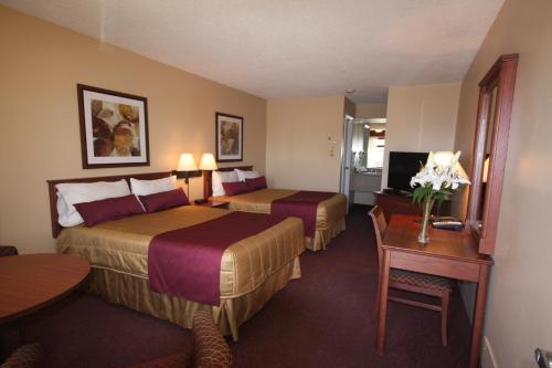 מיטה או מיטות בחדר ב-Motel Adam