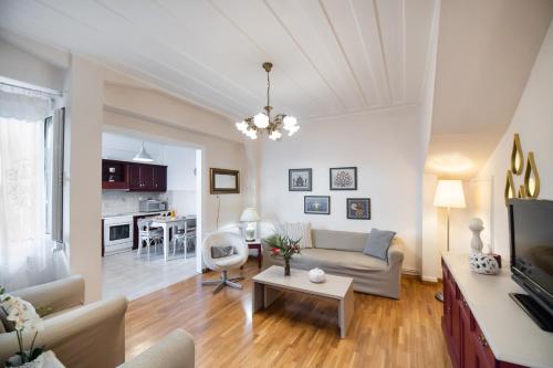 a living room with a couch and a table at Vicolo Appartamenti Locali by Imagine Lefkada in Lefkada Town