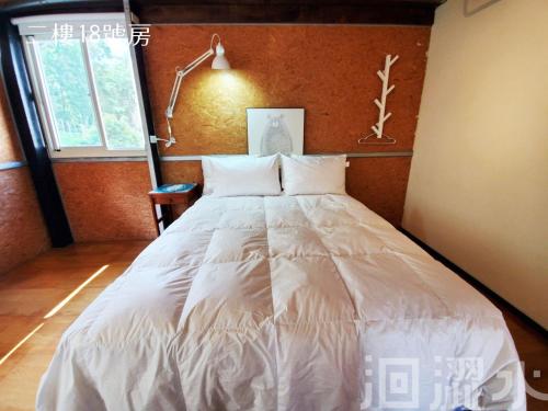 Cama o camas de una habitación en 日月潭洄澀水包棟民宿