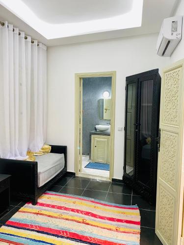 Una cama o camas en una habitación de DAR Riad Jomana