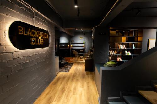 a blackbrook club sign on the wall of a room at BlackBrick Cape Town Foreshore in Cape Town