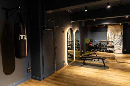 a gym with a bench in the middle of a room at BlackBrick Cape Town Foreshore in Cape Town