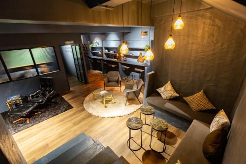an overhead view of a living room with a couch and chairs at BlackBrick Cape Town Foreshore in Cape Town