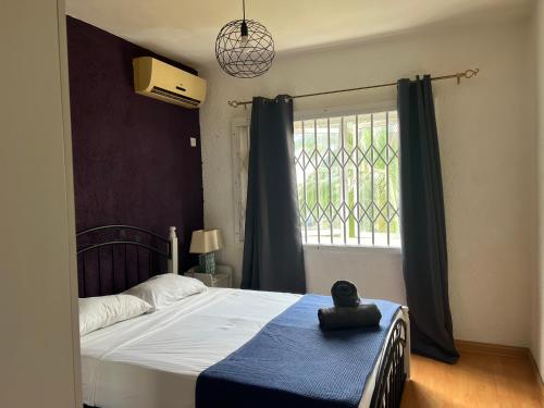Postelja oz. postelje v sobi nastanitve Apartment Tamarinier Complexe