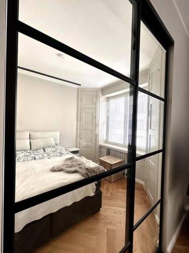 a room with a bed and a window at Luxury City Center Suite in Helsinki
