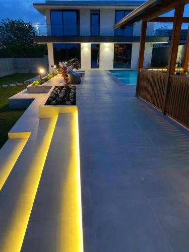 a building with a row of benches with lights at Casa Viilor in Chişinău