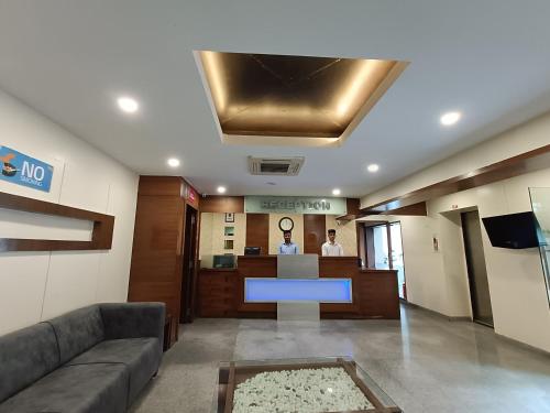 a lobby of an office with a reception desk at Rapid Lakme Executive Hotel in Pune